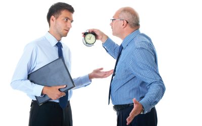 boss holding up clock and reprimanding employee