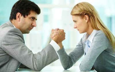 two business people arm wrestling