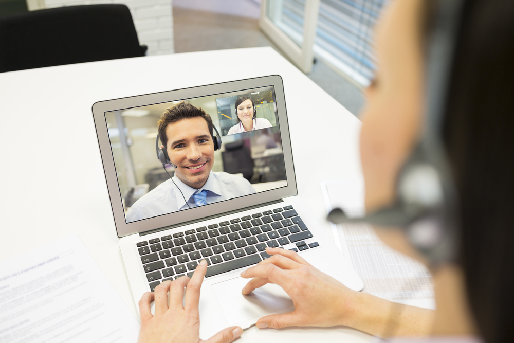 Person talking to colleague over video call