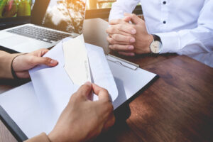 Manager opening a resignation letter